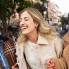 friends smiling and walking together outside