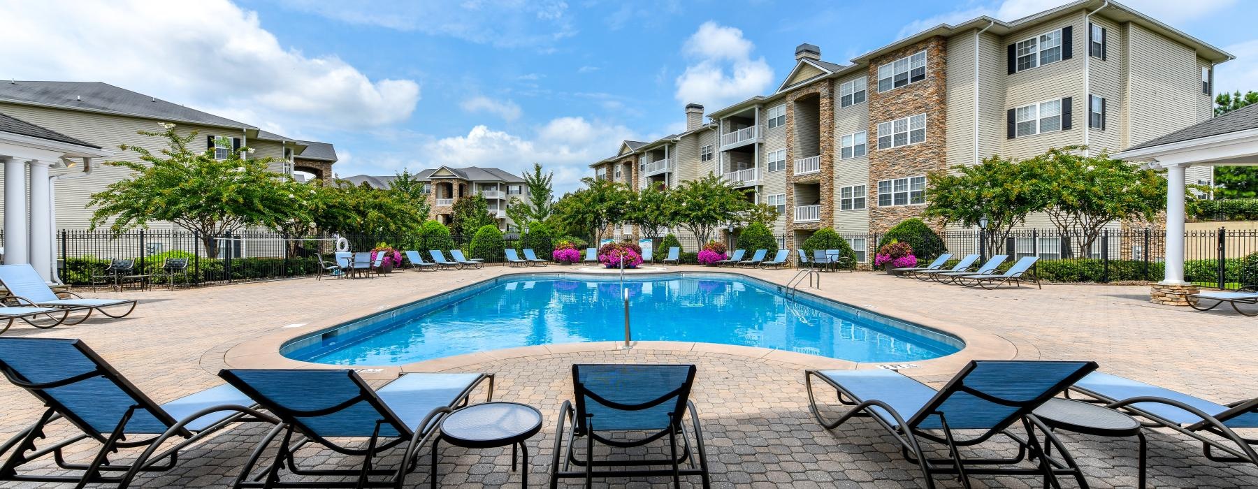 a pool with chairs around it